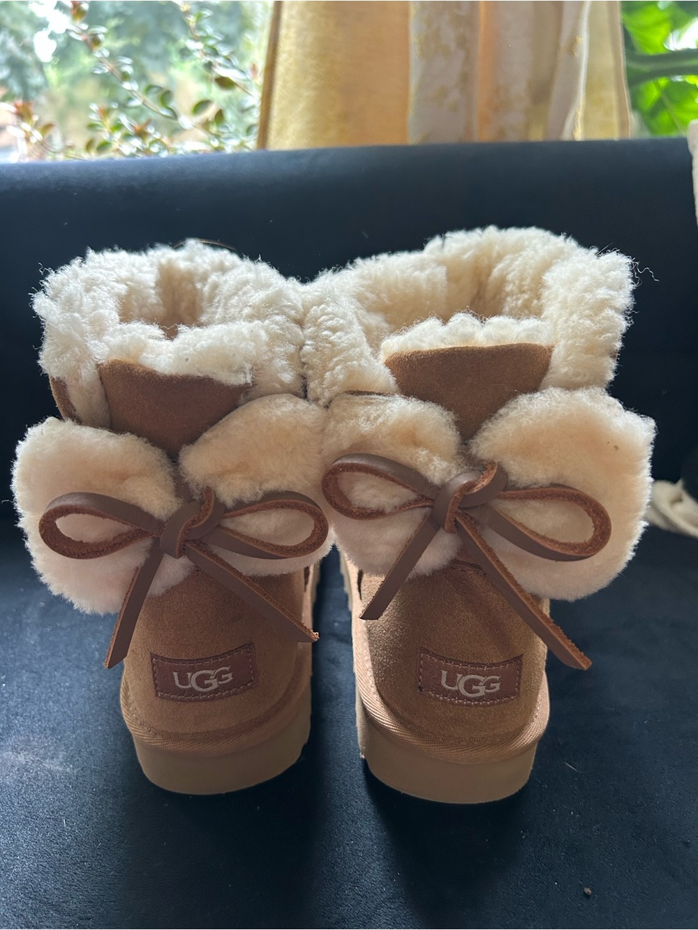 UGG women’s Chestnut Shearling Bow Boots - Chestnut
